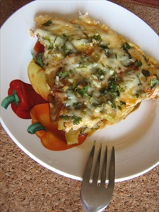 Фото рецепта «Фриттата с кабачками, помидорами, зеленью и пармезаном»